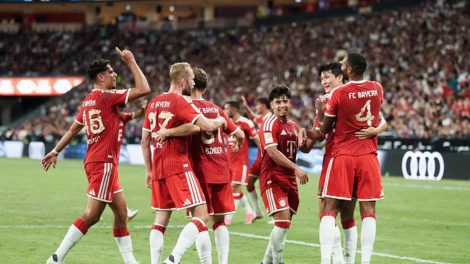 FC Bayern Munich players celebrating together at Audi Football Summit 2026 in Kai Tak Stadium.